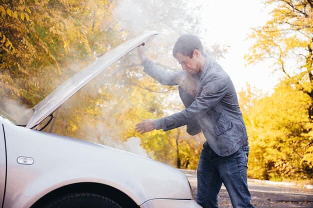 A man lifts the hood of a smoking car