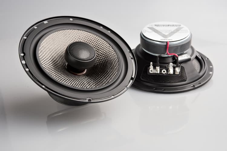 Two car speakers on a white background