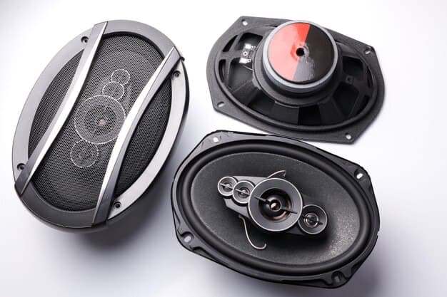 Three car speakers on a white background