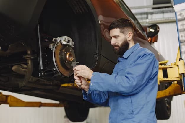 A man with a tool in his hands changes the clutch